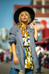 Portrait of young woman standing outdoors
