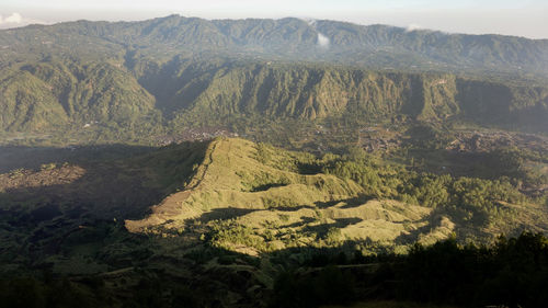 High angle view of trees and mountains against sky