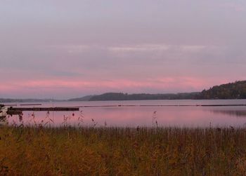 Scenic view of lake against sky during sunset