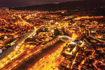 High angle view of illuminated cityscape at night