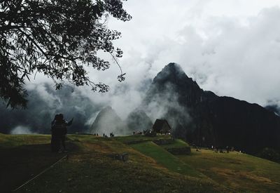 Scenic view of landscape against cloudy sky