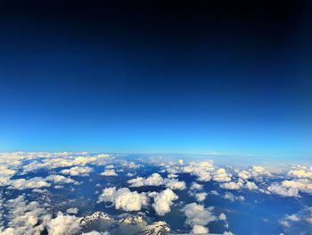 Aerial view of cloudscape against blue sky