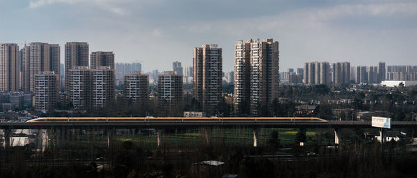 Panoramic view of modern buildings against sky in city