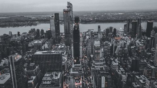 High angle view of modern buildings against sky in city