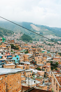 High angle view of buildings in city against sky