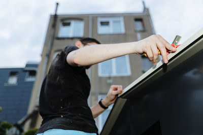 Low section of woman exercising in gym