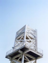 Low angle view of lookout tower against sky