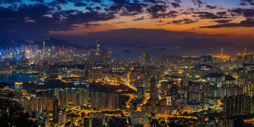 Aerial view of city lit up at night