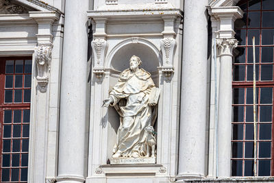 Low angle view of statue against building