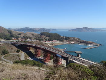 High angle view of bridge over sea against clear sky