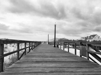 Bethany beach boardwalk against cloudy sky