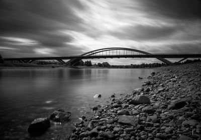 Bridge over river against sky