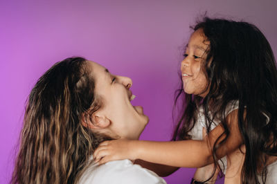 Portrait of mother and daughter