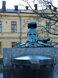 Low angle view of statue against building