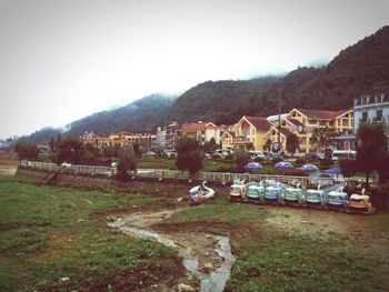 Buildings with mountain range in background