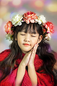 Portrait of a girl with red flower