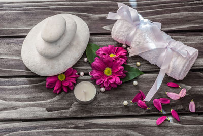 Close-up of flower on wooden table