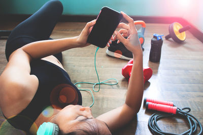 Midsection of woman using mobile phone