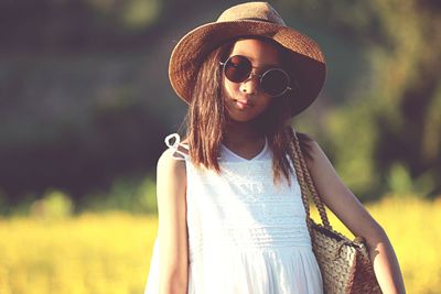 Portrait of girl wearing sunglasses and hat