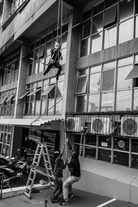 Woman standing in front of building