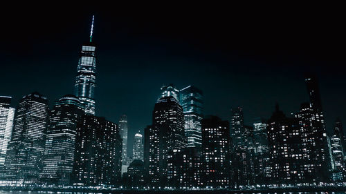 Illuminated buildings in city at night