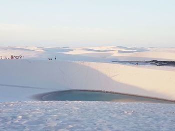 Scenic view of snow covered landscape against sky