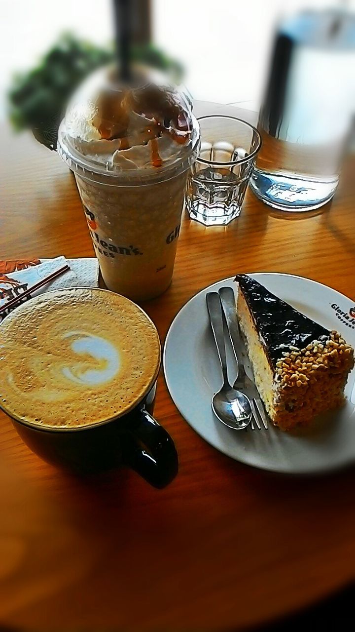 indoors, food and drink, table, drink, refreshment, freshness, still life, drinking glass, coffee cup, sweet food, close-up, coffee - drink, dessert, indulgence, food, ready-to-eat, cake, selective focus, unhealthy eating, plate