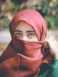 Portrait of young woman wearing hijab