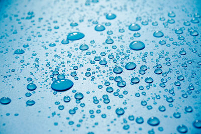 Full frame shot of wet blue raindrops