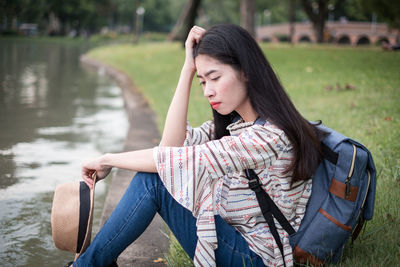 Young woman sitting in water