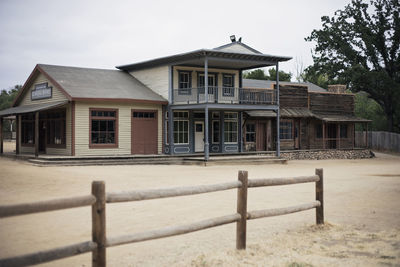 Exterior of house by building against sky