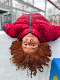 Portrait of young woman standing on snow