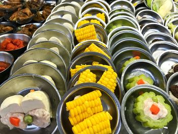 High angle view of multi colored candies in row
