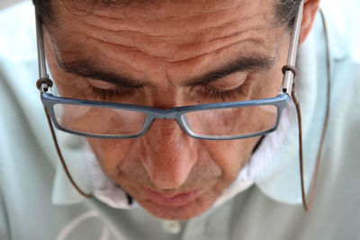 Close-up of man wearing eyeglasses