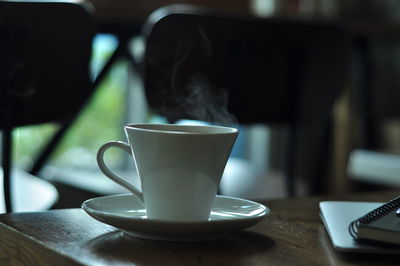 Close-up of coffee cup on table