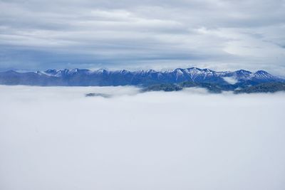 Scenic view of snowcapped mountains against sky