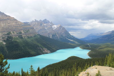 Scenic view of mountains against cloudy sky