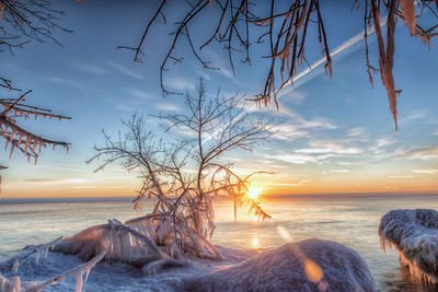 Scenic view of sea against sky at sunset