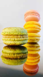 Close-up of stack on table against white background