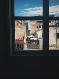 View of buildings through window