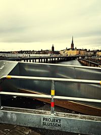 View of bridge against cloudy sky