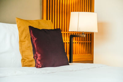 Cushions on bed at home