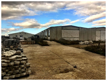 View of buildings against cloudy sky