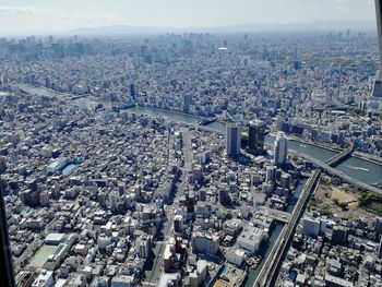 Aerial view of city buildings against sky