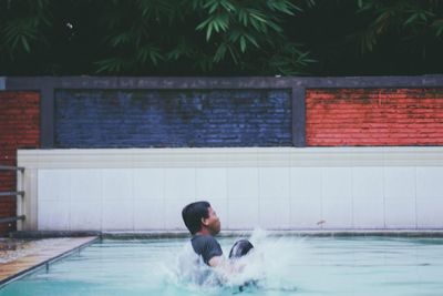 Full length of woman swimming in pool