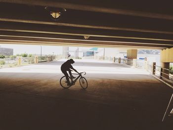Man riding bicycle on city
