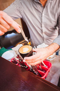 Cropped image of hand holding food