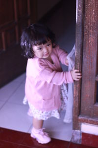 Cute girl standing at home
