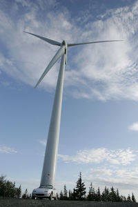 Low angle view of windmill against sky