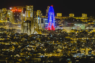 Illuminated buildings in city at night